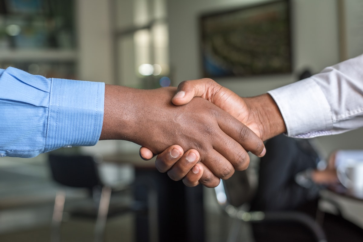 Closing a home sale with a confident handshake